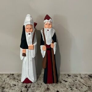 Two wooden Santa Claus figurines